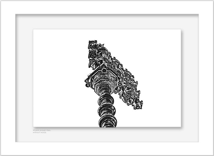 Framed black and white photograph of ornate temple -entrance pillar detail displayed on a wall